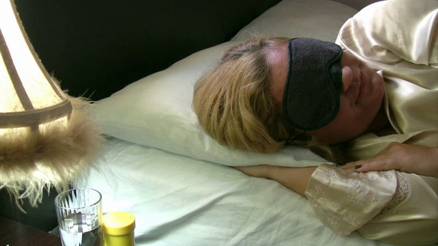 Sleeply sick women taking her pill