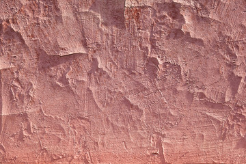 Texture of red wall with cracks and falls off paint