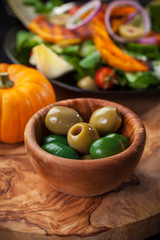 Delicious green olives with salad
