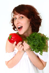 Amazed young woman with vegetables