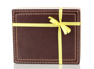 Brown box with ribbon isolated on white