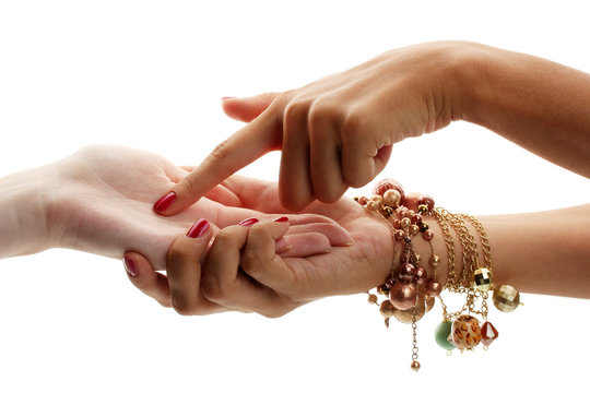reading the lines hand in a woman's hands isolated on white