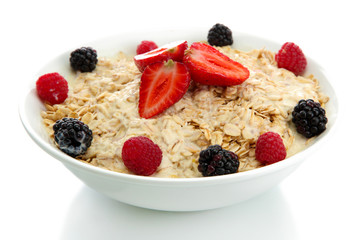 tasty oatmeal with berries, isolated on white