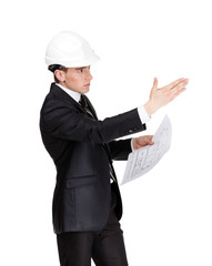 Businessman in white hard hat pointing at something
