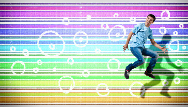 young man dancing and jumping...