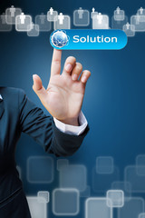 hand of business women pushing a solution button a touch screen