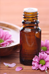 Aromatherapy bottle with pink flowers
