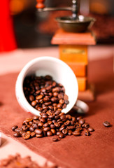 Coffee beans in a cup, blurred surrounding,