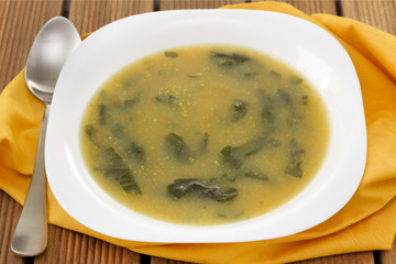 vegetable soup with parsley on the plate