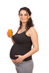 Pregnant woman holding orange juice