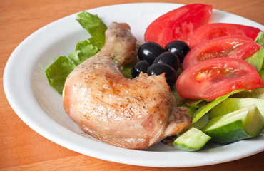 Roast chicken leg with fresh vegetable