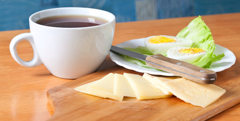 Tea, cheese and boiled egg