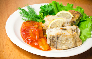 Fried fish on white plate