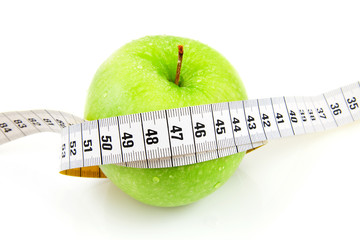 Fresh green apple with measure tape