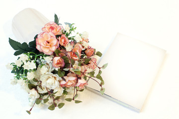 beautiful pink flowers and white book