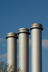 3 exhausts at blue sky