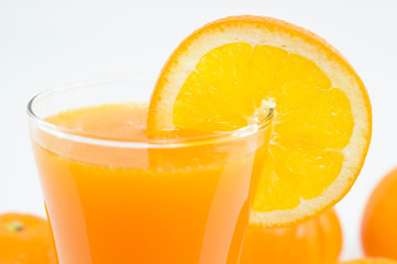 orange juice and slice isolated on white