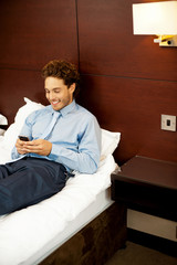 Fototapeta premium Cool businessman sending out messages to his friends