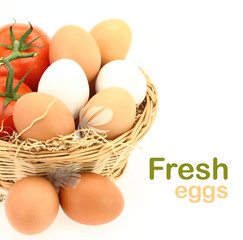 Fresh eggs and tomatoes in the basket