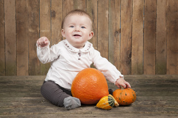 Fototapeta premium halloween baby with pumpkins