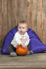baby with pumpkin