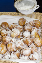 Sugaring fresh baked traditional pastries – closeup