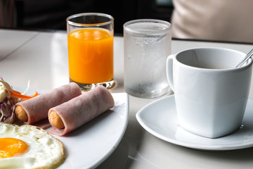 breakfast with fried eggs, juice and coffee