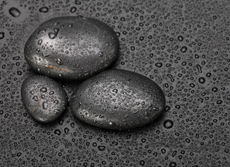 Obraz na płótnie Canvas black stones with water drops