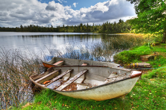 Swedish lake with boat in summer time
