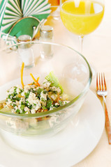 Plate with salad on the laid table