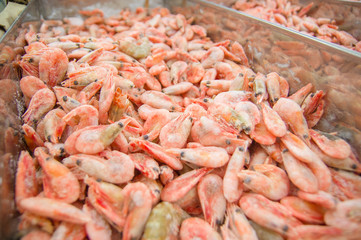 Bunch of fresh shrimps in fridge in supermarket
