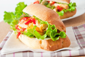 Grilled chicken sandwich with paprika and lettuce 