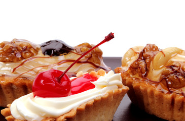 Cake with cream and cherry