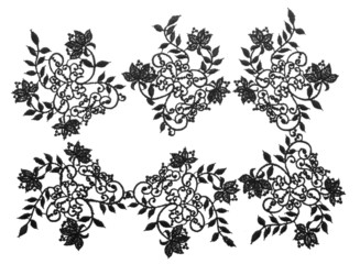 Embroidered lace trim over white. Fabric texture