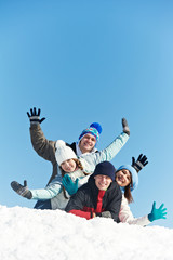 group of happy young people in winter