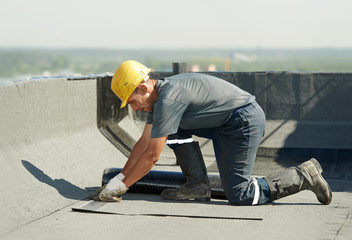 Flat roof covering works with roofing felt - obrazy, fototapety, plakaty