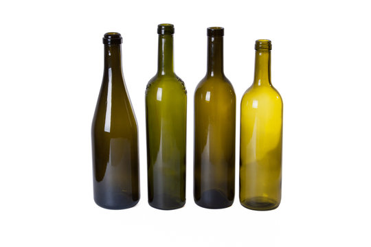 four dark empty wine bottles