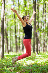 Young woman jumping for joy