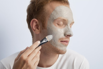 Fototapeta premium Man's facial cosmetic treatment.