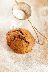 soft ginger cookie on dusted  wooden table