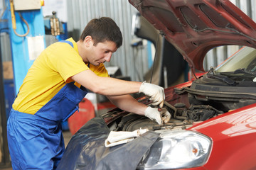 auto mechanic at work with wrench