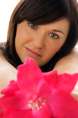 Fototapeta premium pretty young woman with a flower
