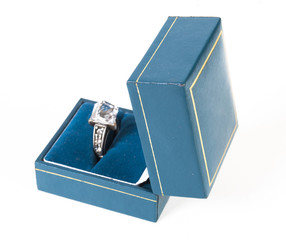 wedding ring in box over white