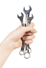 wrench in his hand on a white background