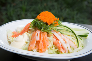 Healthy garden salad in stylish white plate