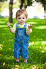 happy baby resting on the green grass