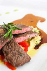 Sirloin beef steak with mashed potato and tomato