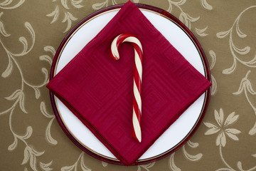 candy cane with red table napkin