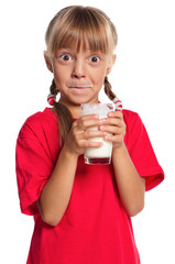 Little girl with glass of milk