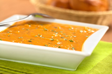 Bowl of fresh homemade sweet potato soup with thyme